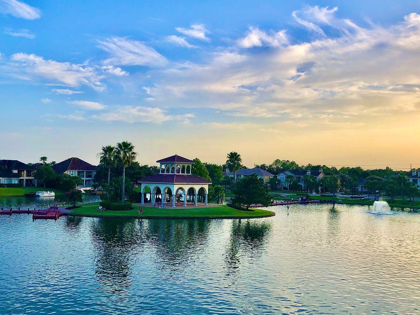 A scenic lake and waterfront homes in Lake County, Florida at sunset.